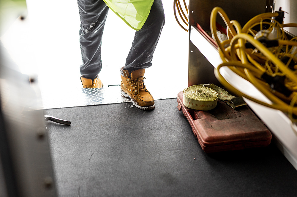 Van Fleet Employee stepping into a safe and durable rigid floor created by Legend